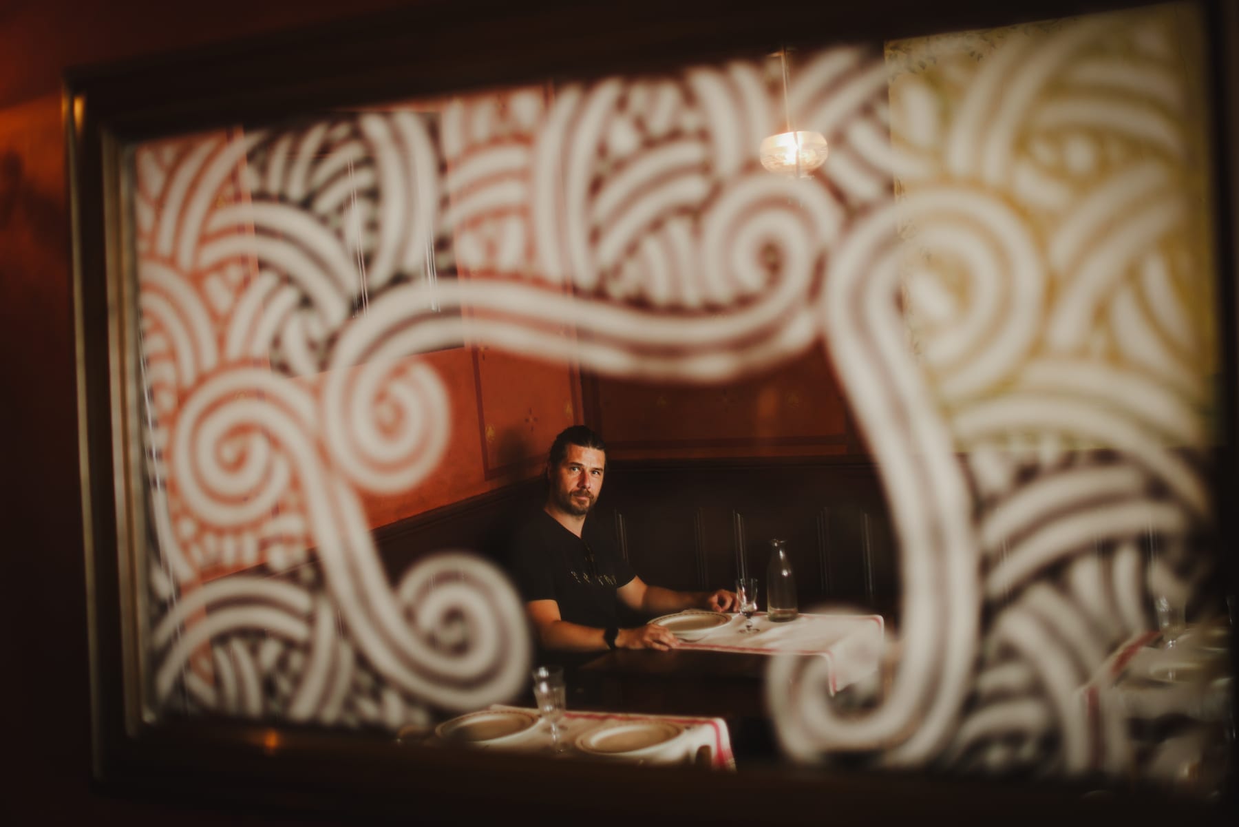 The Auberge Ravoux dining room seen through the mirror drawn by Jordane Saget