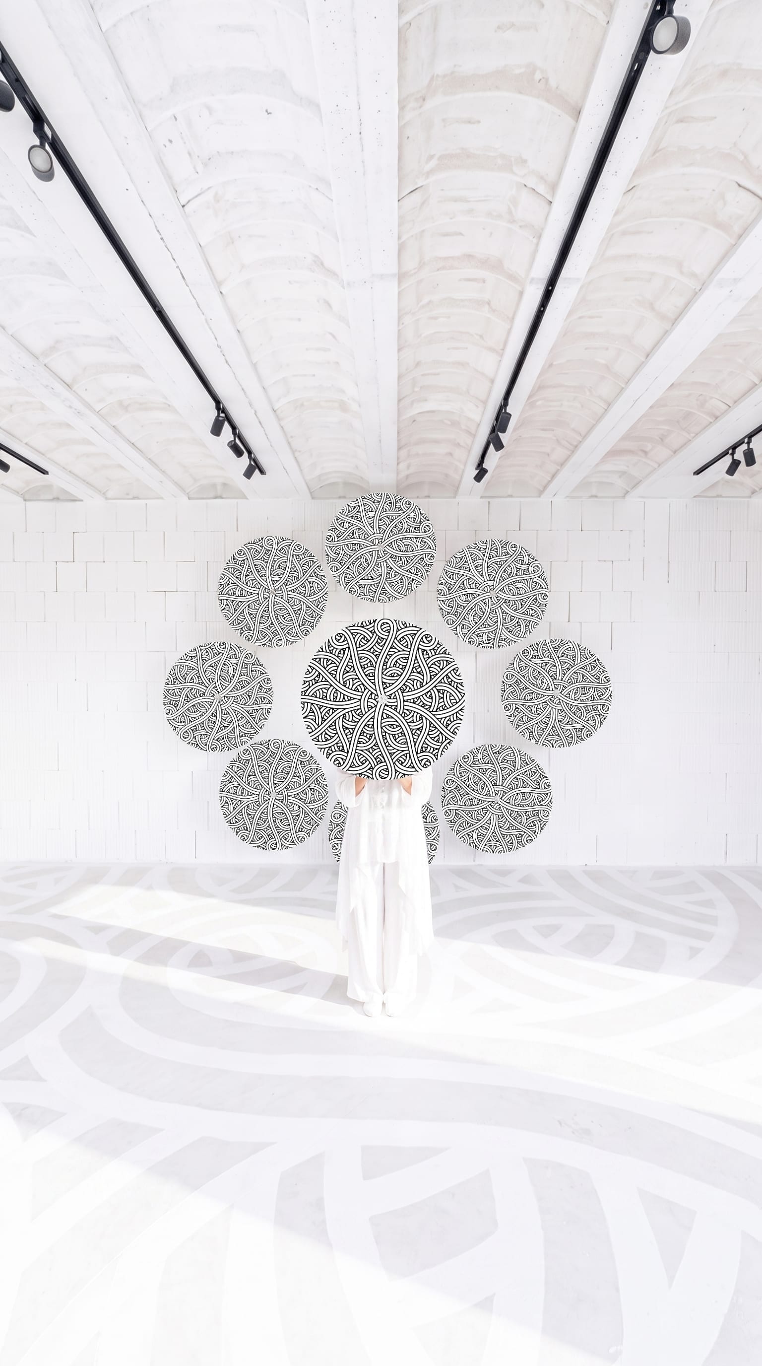 Jordane Saget's rose windows suspended in the LabMusée white room
